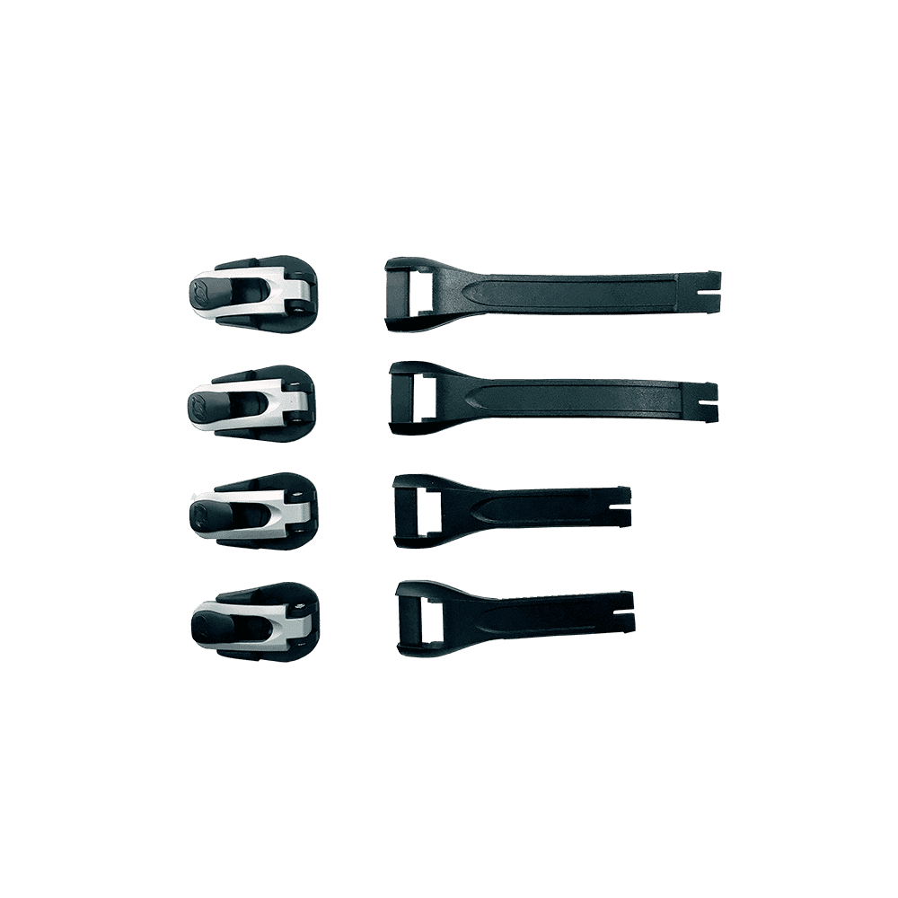 Sechs O'NEAL RMX Boot Full Buckle/Strap Kit Teile mit schwarzen und weißen Schnallen in vertikaler Anordnung auf der linken Seite und schwarzen Riemen auf der rechten Seite werden vor einem einfarbigen grünen Hintergrund dargestellt.