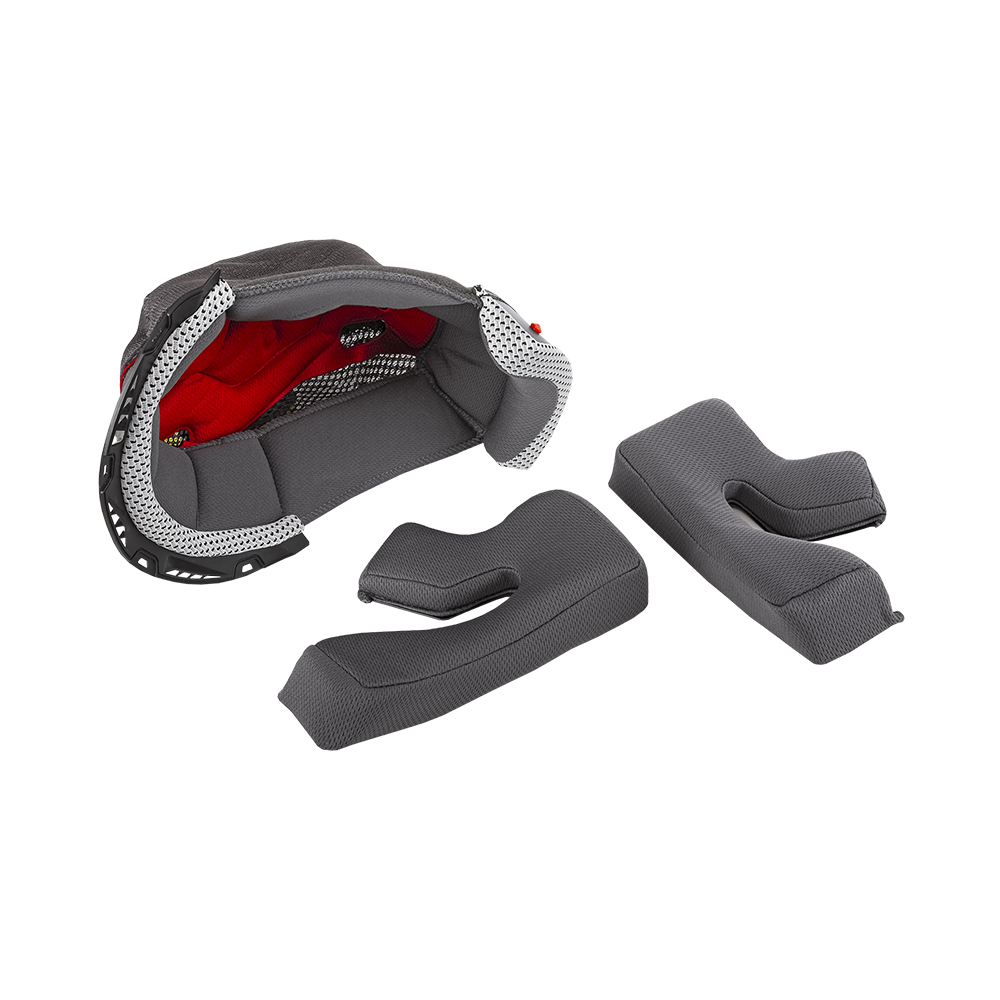 O'NEAL Liner & Cheek Pads 3SRS Helmet von O'NEAL: Abnehmbare graue gepolsterte Pads mit strukturierter Oberfläche, dargestellt neben einer teilweise demontierten roten und grauen Helmauskleidung auf weißem Hintergrund.