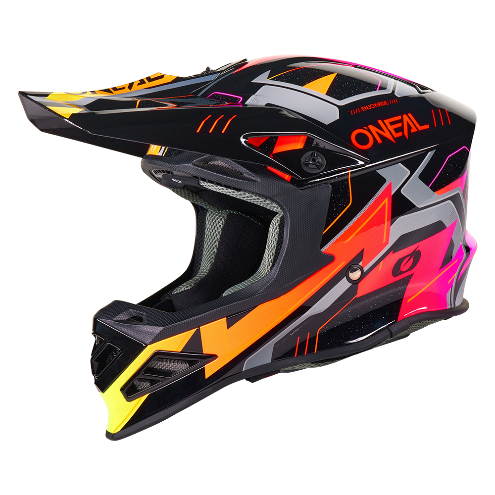 Der O'NEAL F-SRS Helm CRUX hat eine schwarze Schale mit kantigen neonorangen, pinken, gelben und grauen Grafiken, ein großes Visier und den Schriftzug O'NEAL" in Orange an der Seite.