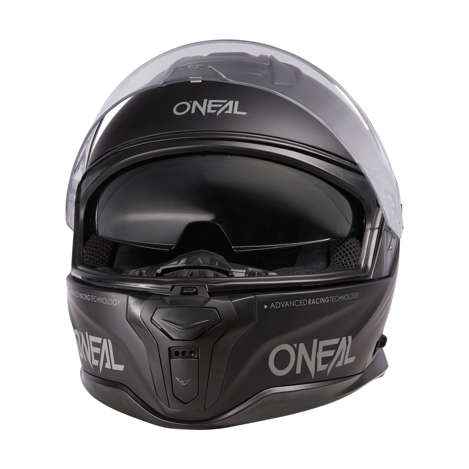 Ein mattschwarzer Vollvisierhelm O'NEAL CHALLENGER Helm SOLID mit klarem Visier, getönter innerer Sonnenblende und O'NEAL-Branding auf der Vorderseite, an den Seiten und am Kinn, abgebildet vor einem weißen Hintergrund.