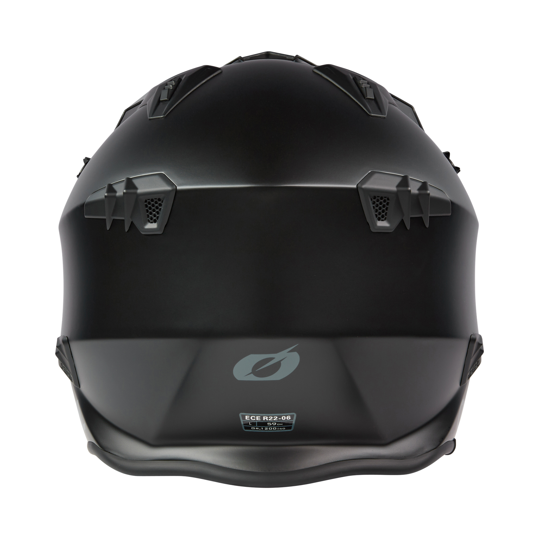 Ein mattschwarzer O'NEAL VOLT Helm SOLID Motorradhelm von hinten gesehen, mit kantigen Belüftungsöffnungen, geometrischen Mustern, einem dezenten O'NEAL-Logo und einem Zertifizierungsaufkleber in der Nähe der Basis.
