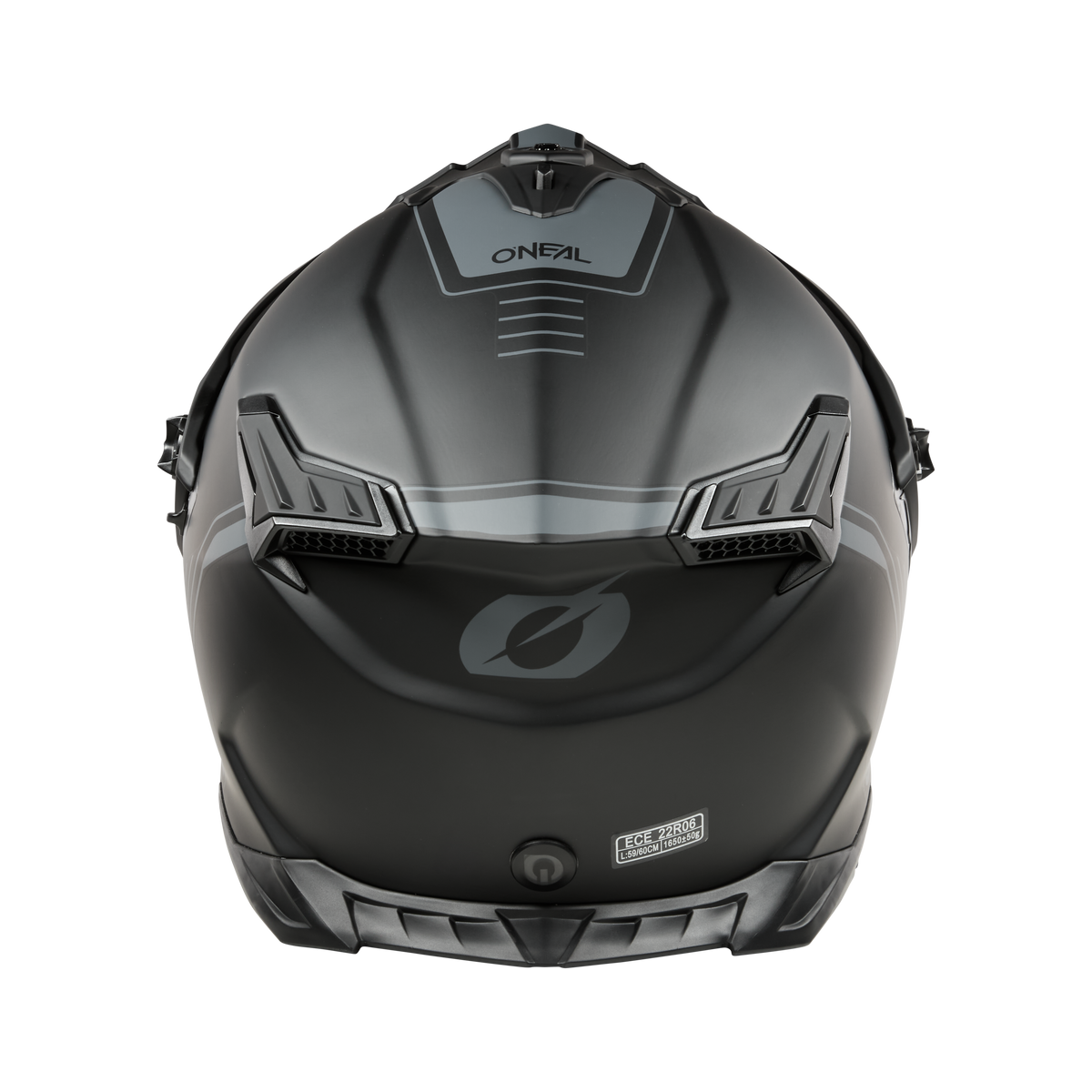 Der O'NEAL A-SRS Helm SOLID in mattem Schwarz zeigt sich von hinten mit kantigen Belüftungsöffnungen, dem O'NEAL-Logo, einem "Fidlock"-Magnetschnallen-Etikett und Bluetooth-fähigen Funktionen für Stil und Technik.