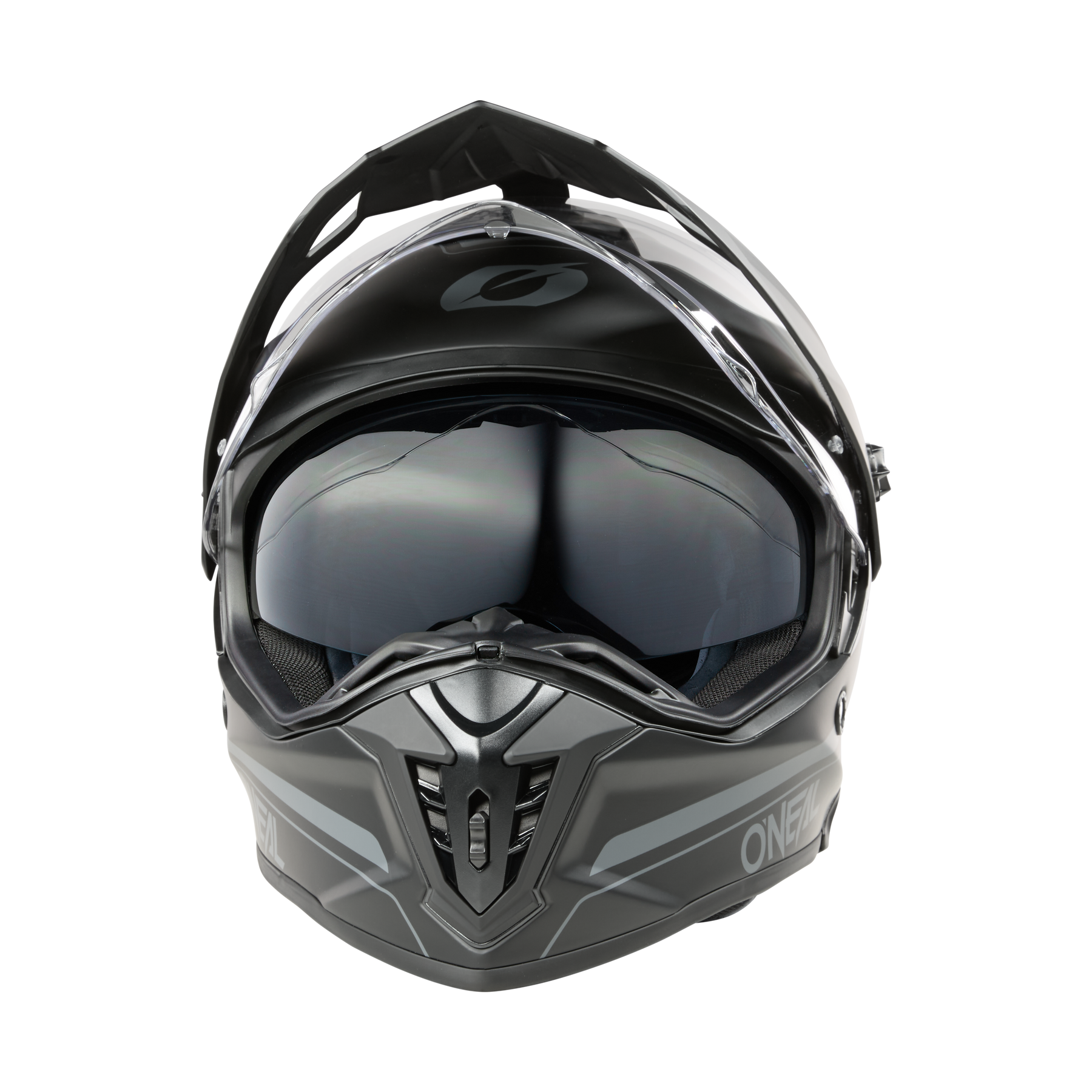 Ein mattgrauer O'NEAL A-SRS Helmet SOLID, ein Motorradhelm aus Fiberglas mit klarem Visier, schwarzen Belüftungsöffnungen, kantigem Design und Bluetooth-fähigen Funktionen, ist von vorne auf einem schwarzen Hintergrund abgebildet.