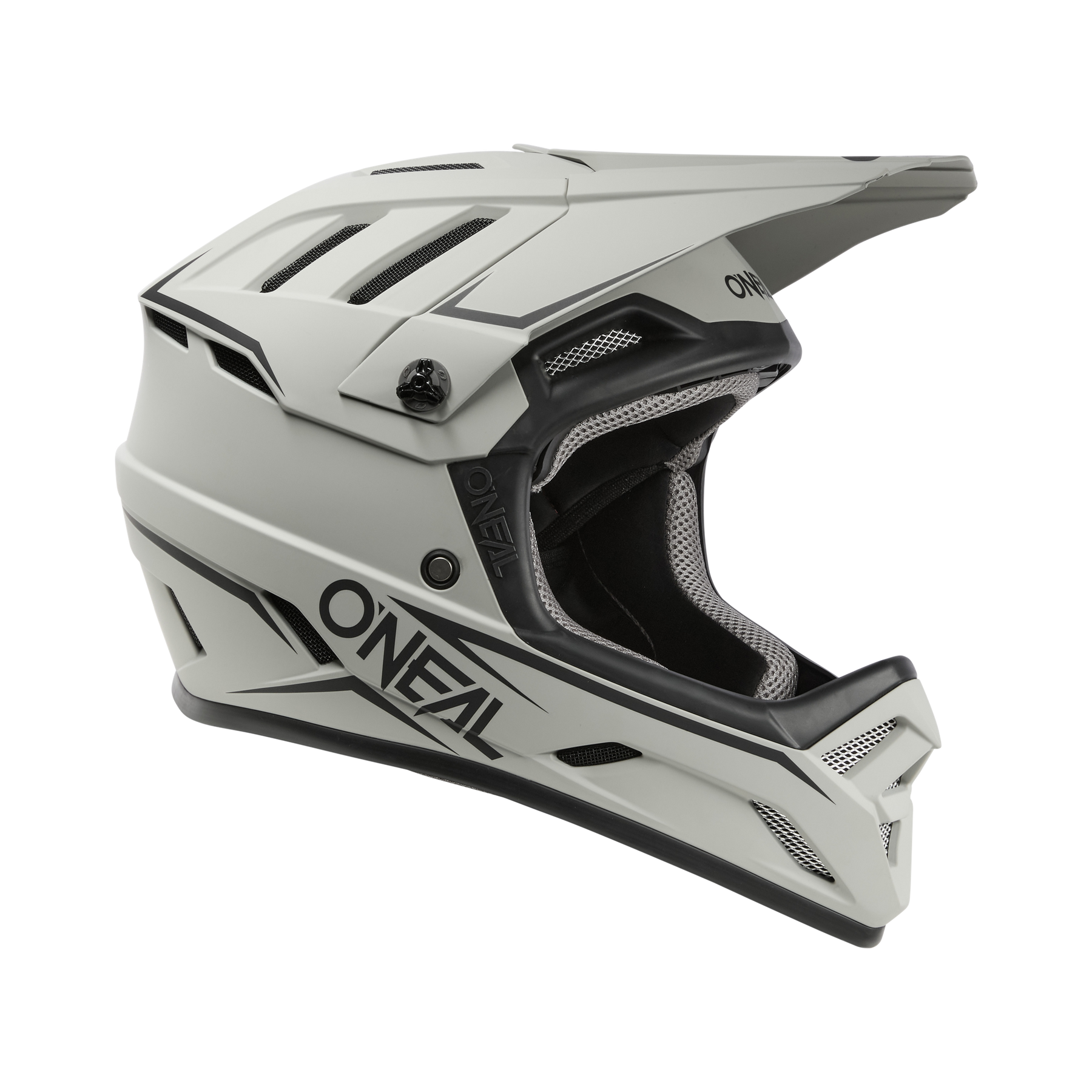 Der O'NEAL BACKFLIP Helm SOLID - ein weißer Integralhelm mit schwarzen Akzenten, Belüftungsschlitzen und einem Visier - wird im Seitenprofil vor einem unifarbenen Hintergrund gezeigt, ideal für Motocross oder Mountainbiking.