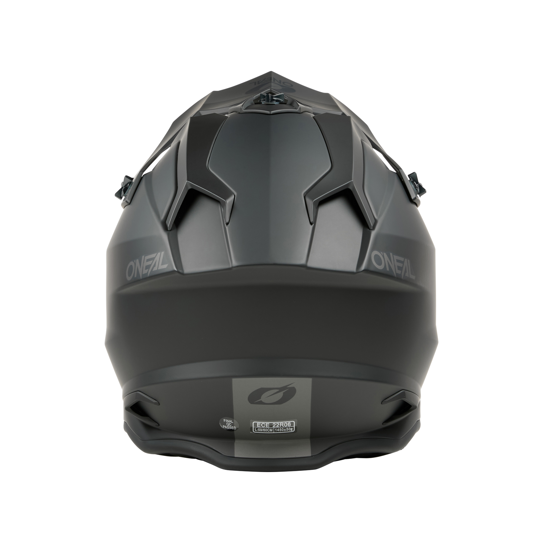 Ein mattschwarzer O'NEAL C-SRS Helm SOLID von O'NEAL, der sich von hinten mit kantigen Belüftungsöffnungen, dem O'NEAL-Logo, aerodynamischen Details und einem eleganten Look für maximale Sicherheit zeigt.
