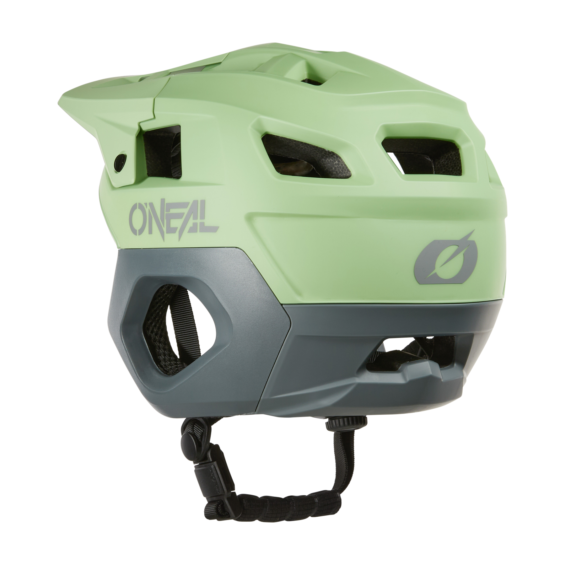 Der O'NEAL TRAPPER Helmet SOLID in Hellgrün und Grau verfügt über große Belüftungsöffnungen, ein Visier und einen verstellbaren Kinnriemen - hier von der Rückseite aus gesehen - und eignet sich ideal als Enduro-Helm für Komfort und Schutz.