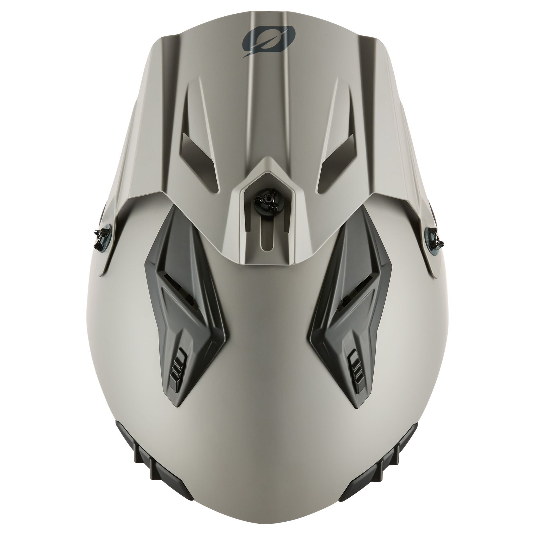Die Draufsicht auf den grauen, kantigen O'NEAL VOLT Helm SOLID zeigt zwei schwarze Lüftungsschlitze und ein zentrales Emblem auf der Vorderseite, das für mehr Sicherheit sorgt.