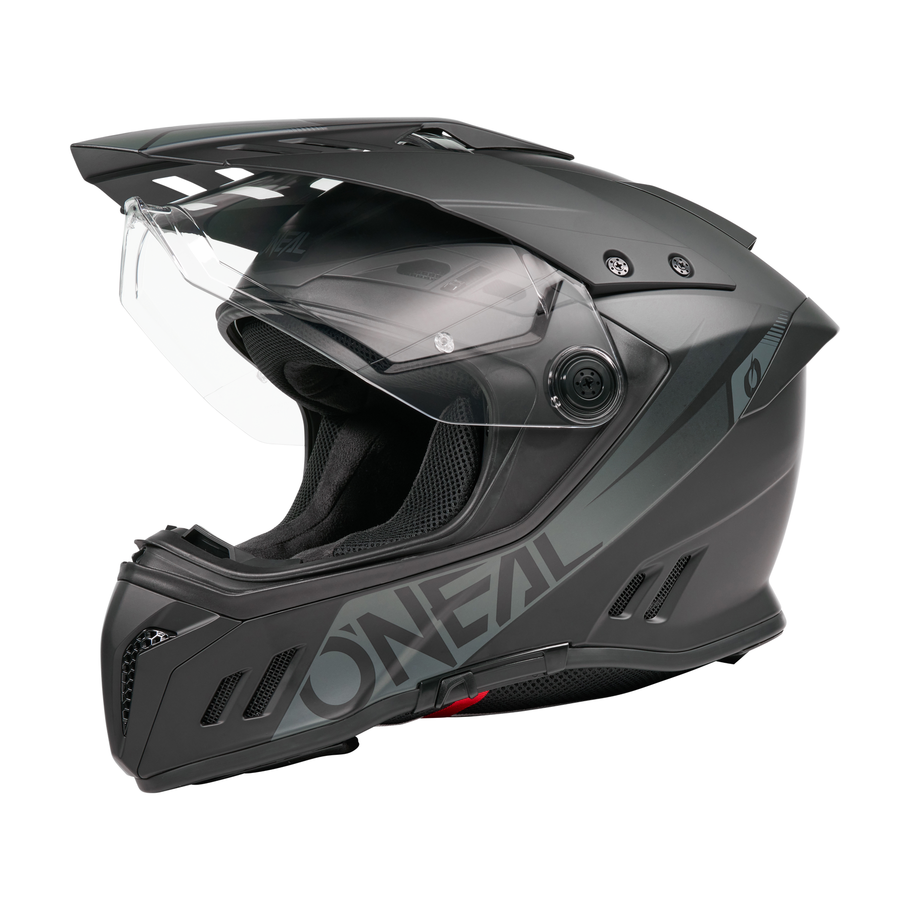 Ein Schwarz/Weiß O'NEAL SIERRA RS Helm SOLID mit klarem Visier, aerodynamischen Belüftungsöffnungen, Quin Smart Safety Sensor und fetten seitlichen Schriftzügen wird vor einem schlichten schwarzen Hintergrund dargestellt.