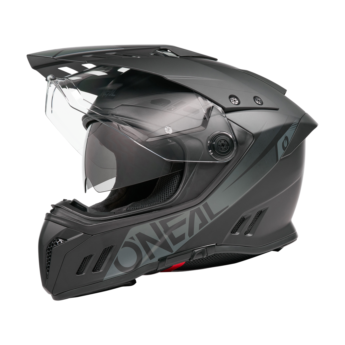 Ein mattschwarzer O'NEAL SIERRA RS Helm SOLID Motorradhelm mit klarem Visier, aerodynamischen Belüftungsöffnungen und stabilem Kinnschutz, dargestellt im Seitenprofil auf transparentem Hintergrund. Kompatibel mit Quin Smart Safety Sensor.