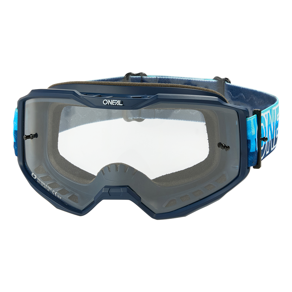 Die O'NEAL B-10 Goggle STRIPED verfügt über ein klares Glas, einen blauen Rahmen und ein verstellbares blaues Band mit dem O'NEAL-Logo und bietet Schutz für die Augen bei Fahrten im Gelände.