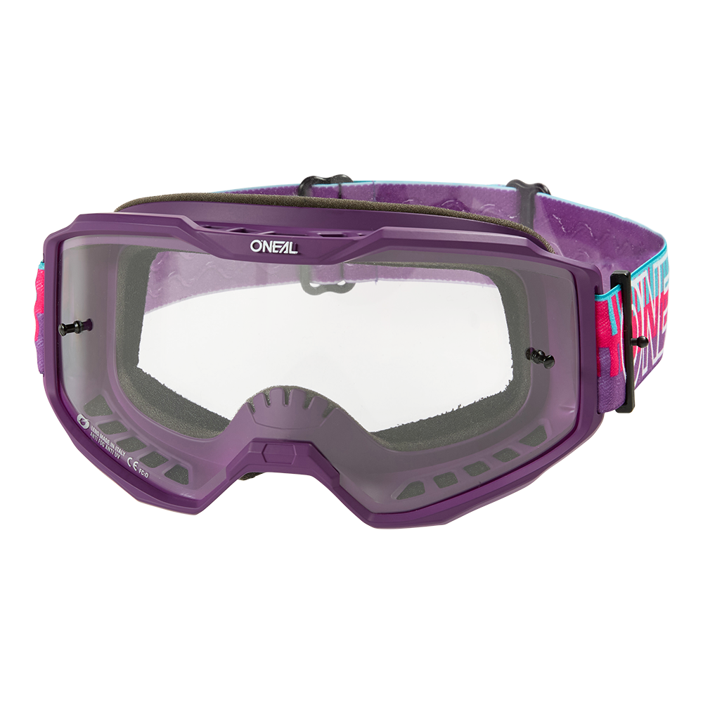 Die O'NEAL B-10 Goggle STRIPED hat einen violetten Rahmen, klare Gläser, eine schwarze Schaumstoffpolsterung und ein verstellbares Band mit dem O'NEAL-Logo in Pink, Blau und Weiß.