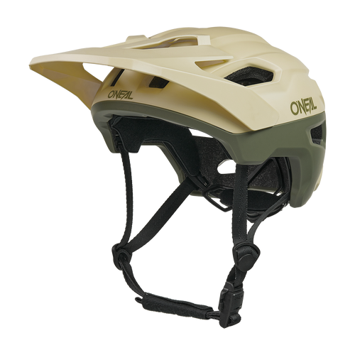 Le casque O'NEAL TRAILFINDER EVO SOLID est un casque de VTT beige et vert olive avec une visière, plusieurs ouvertures d'aération, des jugulaires noires réglables et il est compatible avec le capteur de sécurité Quin Smart en option.