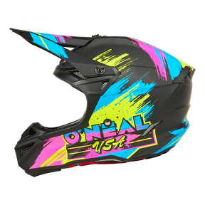 Ein schwarzer O'NEAL 5SRS Polyacrylite Helm RESEDA mit einem Kinnschutz und leuchtenden neonblauen, gelben und pinken Farbspritzern an der Seite.