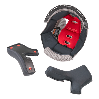 O'NEAL Liner & Cheek Pads 1SRS Helm gezeigt entfernt und auf einem weißen Hintergrund angeordnet. Die Schwarz/Grau Pads sind hauptsächlich schwarz mit grauen Akzenten, entworfen für O'NEAL Helme.
