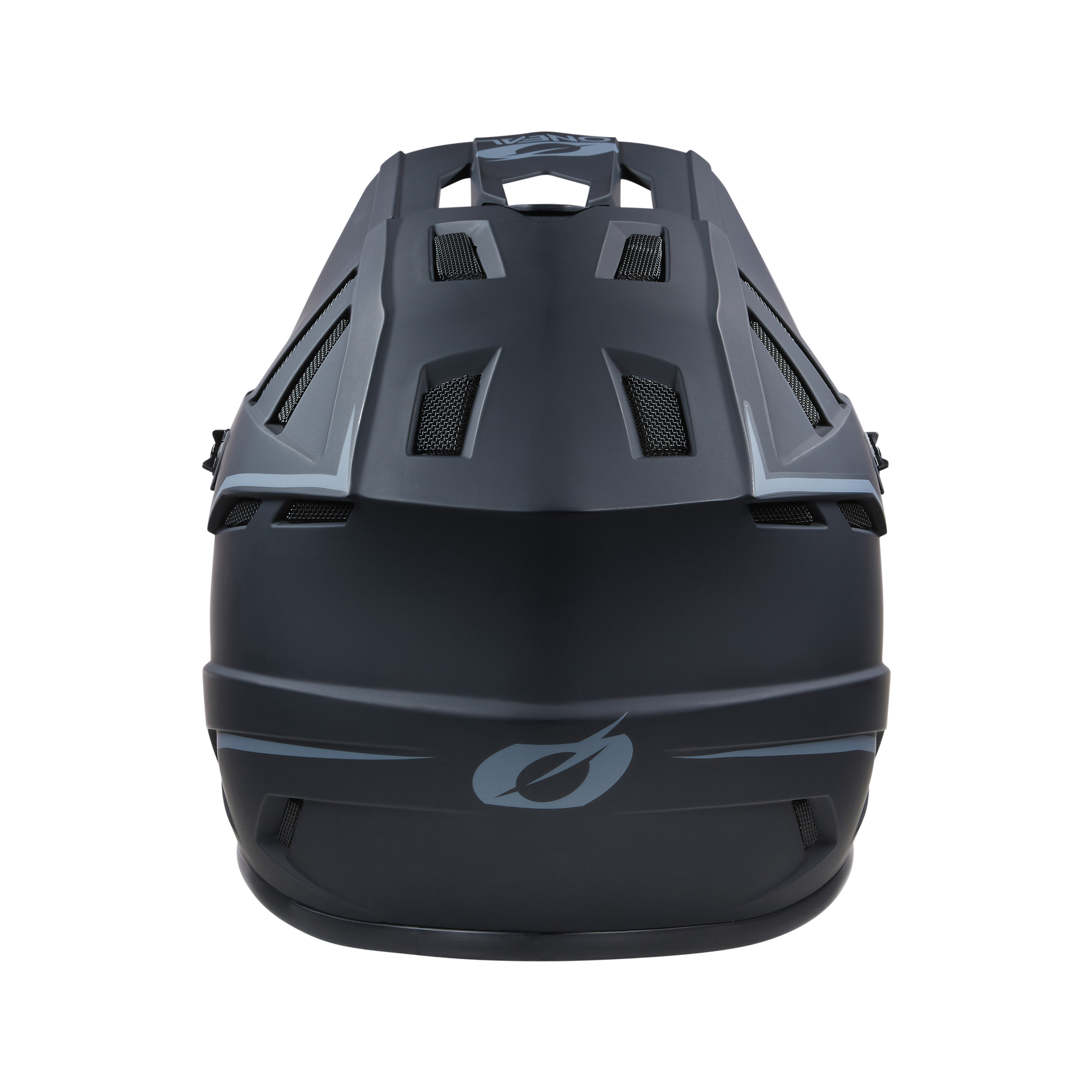 Eine Draufsicht auf den O'NEAL BACKFLIP Helm SOLID von O'NEAL, der sein schwarzes, aerodynamisches Design mit geometrischen Belüftungsmustern und einem glatten, matten Finish zeigt. Der Helm verfügt über ein minimalistisches Grafiklogo auf der Vorderseite und bietet sowohl Stil als auch Sicherheit für Mountainbike-Experten.