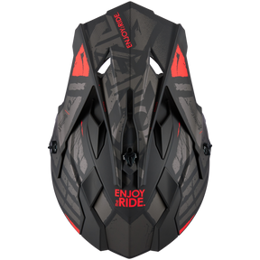 Der O'NEAL 2SRS Helm GLITCH zeichnet sich durch ein markantes schwarz-graues Design mit geometrischen Mustern und auffälligen roten Akzenten aus. „ENJOY THE RIDE“ steht fett in Rot auf der Vorderseite und vermittelt eine robuste Atmosphäre, die ideal für Nervenkitzel-Suchende ist.