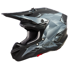 Ein eleganter, schwarz-grauer Integralhelm mit eckigen, geometrischen Mustern und dem Markennamen „O'Neal“ auf der Seite. Dieser O'NEAL 5SRS Polyacrylite Helm SURGE verfügt über ein markantes Visier, Belüftungsöffnungen und eine gepolsterte Innenseite für hochwertige Technik, die Sicherheit und Komfort gewährleistet.