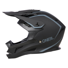 Der O'NEAL DROP DH Helm SOLID, ein mattschwarzer Integralhelm mit blauen Akzenten und einem schlanken, eckigen Design, verfügt über ein weißes Branding an der Seite, ein großes Visier und eine robuste Konstruktion. Dieser Helm bietet sowohl Komfort als auch Sicherheit für Motorsport- oder Radsportbegeisterte.