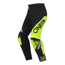 Ein Paar O'NEAL ELEMENT Hose SHOCKER von O'Neal in Schwarz und Neongelb, perfekt für Motorsport-Fans. Mit mehreren Logos und Texten, verstärkten Kniebereichen und dem Aufdruck „ENJOY THE RIDE“ auf dem rechten Bein bietet diese Hose sowohl ein auffälliges Design als auch Komfort mit Schutz.