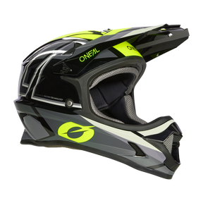 Der O'NEAL SONUS Helm SPLIT ist ein hochwertiger Integralhelm für Motorradfahrer in Schwarz und Neongelb. Er verfügt über ein aerodynamisches Design, Belüftungsöffnungen, ein Visier und einen Kinnschutz. Der Markenname „O'NeAL“ ist prominent auf der Seite angebracht.
