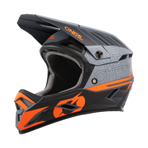 Der O'NEAL BACKFLIP Helm ECLIPSE ist ein schwarz-grauer Fullface-MTB-Helm mit leuchtend orangen Akzenten, einem Visier und einer großen Belüftung an der Vorderseite, der für Mountainbikes oder Downhills entwickelt wurde.