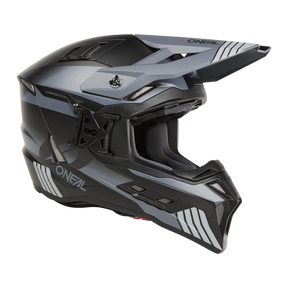 Der O'NEAL EX-SRS Helmet HITCH ist ein eleganter schwarz-grauer Integralhelm mit eckigen Linien und kontrastierenden hellen und dunklen Mustern. Er verfügt über ein verstellbares Visier, Belüftungsöffnungen mit integrierten AirflapsTM und eine gepolsterte Innenausstattung für Komfort während der Fahrt.