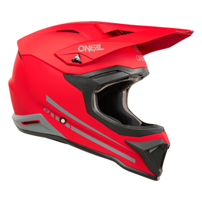 Ein leuchtend roter O'NEAL 1SRS Helm SOLID Integral-Motocrosshelm, der durch hochwertige Technik mit grauen Akzenten und schwarzer Innenpolsterung besticht. Der O'NEAL 1SRS Helm SOLID verfügt über eckige Designelemente, ein markantes Visier und Belüftungsöffnungen. Das O'Neal-Logo ist an den Seiten und vorne sichtbar.