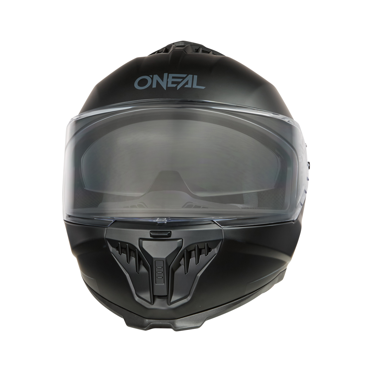 Der O'NEAL CHALLENGER Helm SOLID, ein eleganter schwarzer Integralhelm, trägt das „O'NEAL“-Branding auf der Stirn. Er verfügt über ein klares Visier und einen belüfteten Kinnschutz und hebt sich mit seinem modernen Design vom schwarzen Hintergrund ab.