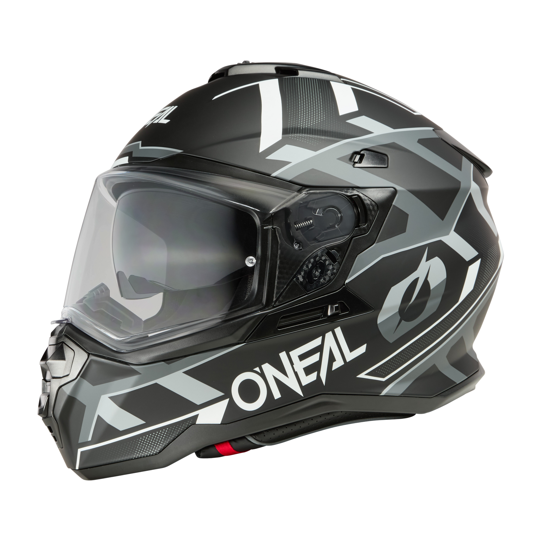 Ein schwarzer O'NEAL D-SRS Helm SQUARE mit klarem Visier und kantigen grauen und weißen geometrischen Mustern ist in einer Seitenansicht vor schwarzem Hintergrund zu sehen.