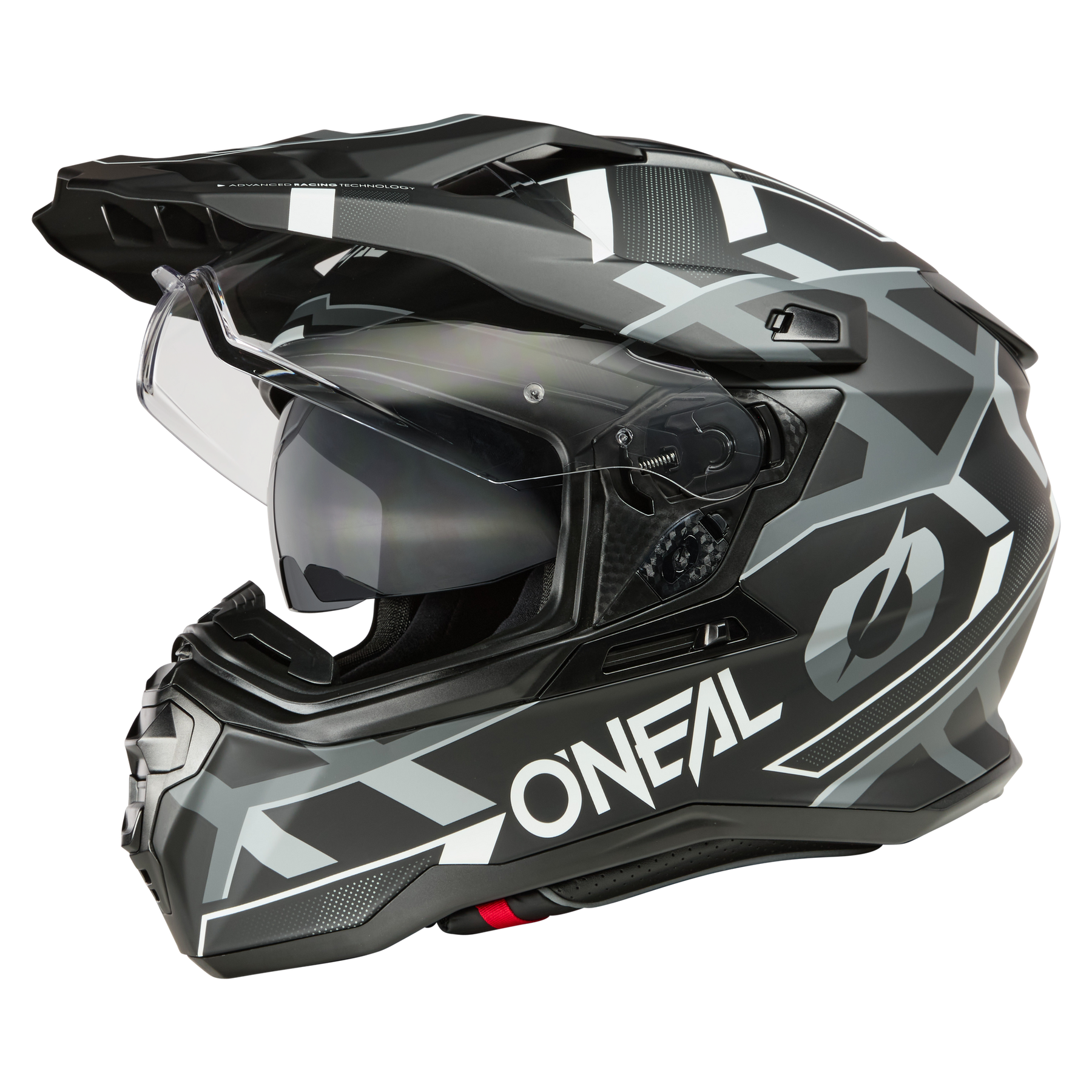 Der O'NEAL D-SRS Helm SQUARE ist ein schwarzer und grauer Motocross-Helm mit geometrischen Mustern, klarem Visier und auffälligem "ONEAL"-Schriftzug, der dem Fahrer sowohl Stil als auch Sicherheit bietet.