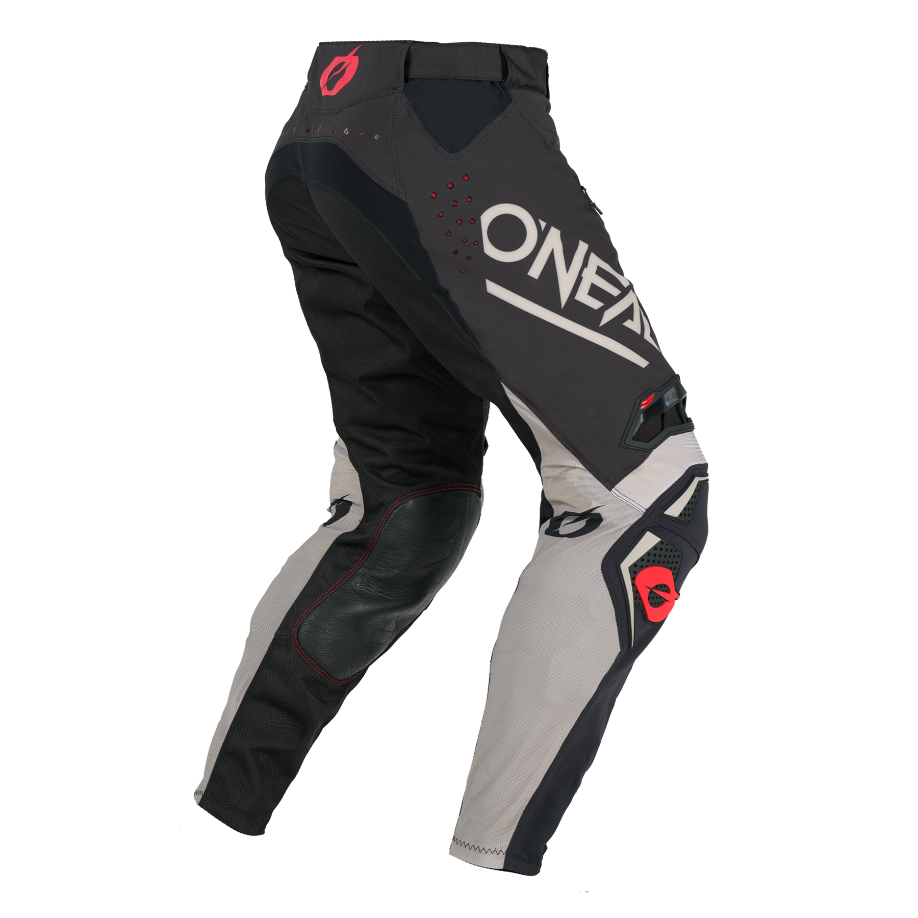 Die O'NEAL PRODIGY Hose FIVE FOUR Motocross-Hose in Schwarz, Grau und Beige verfügt über gepolsterte Knie zum Schutz, rote Akzente und ein großes weißes "ONEAL"-Branding auf dem Oberschenkel. Ausgestellt auf einer unsichtbaren Schaufensterpuppe aus einem seitlichen Winkel.