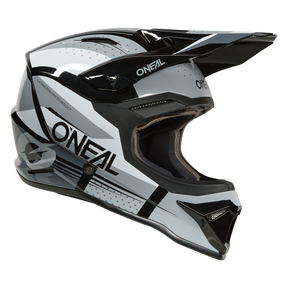 Der O'NEAL 1SRS Helmet RC ist ein Fullface-Motocross-Helm in Schwarz, Weiß und Grau mit Visier und aerodynamischem Design, von der Seite betrachtet.