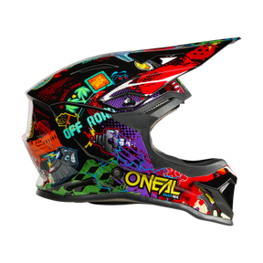 Der O'NEAL 1SRS Youth Helmet VIBRANT ist ein farbenfroher Off-Road-Helm mit Visier, auffälligen Grafiken, Graffiti-Schriftzügen und Cartoon-Illustrationen. Der Schriftzug "O'NEAL" ist prominent an der Seite angebracht.