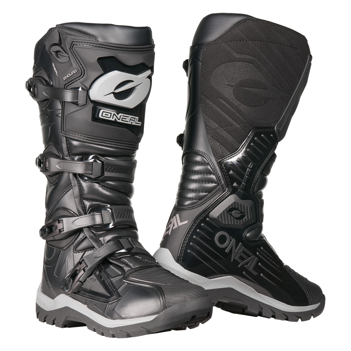 Der O'NEAL RMX Adventure Boot in Schwarz mit grauen und weißen Akzenten verfügt über Schnallen, strukturierte Einsätze und robuste Sohlen zum Schutz - die perfekte Motorsportausrüstung für ernsthafte Fahrer. Abgebildet auf einem weißen Hintergrund.