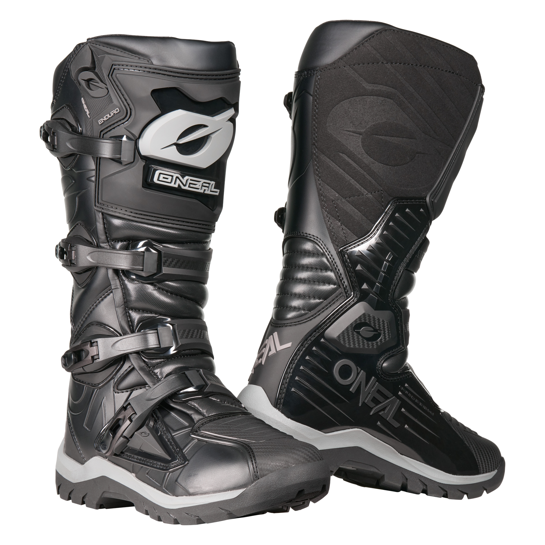Der O'NEAL RMX Adventure Boot in Schwarz mit grauen und weißen Akzenten verfügt über Schnallen, strukturierte Einsätze und robuste Sohlen zum Schutz - die perfekte Motorsportausrüstung für ernsthafte Fahrer. Abgebildet auf einem weißen Hintergrund.